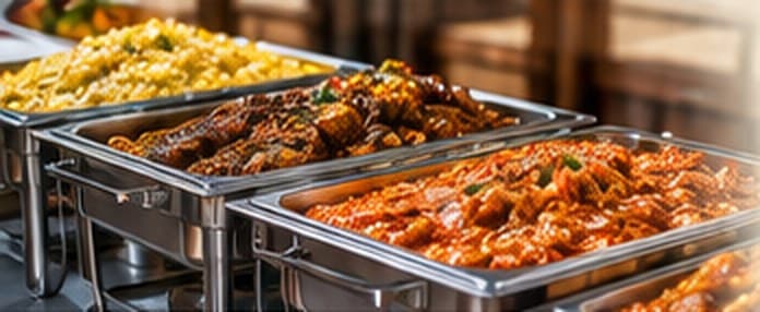 Catering trays of Nigerian dishes